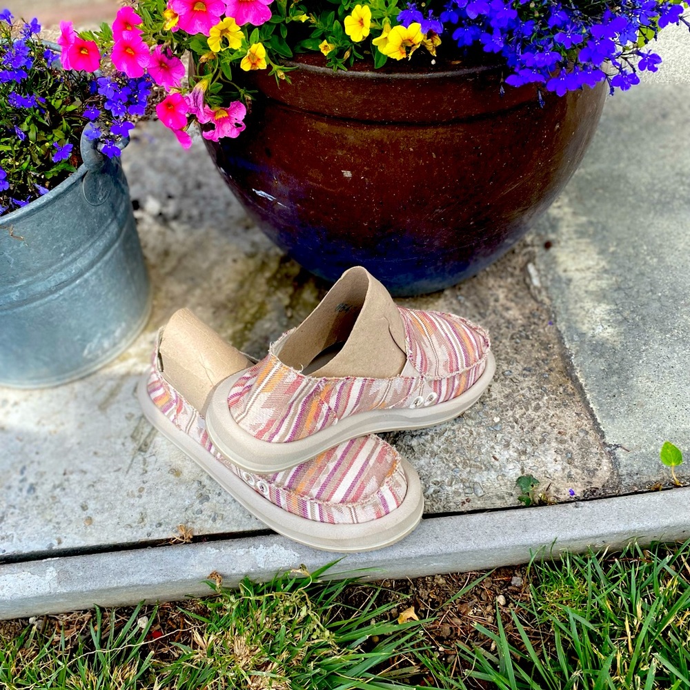 Sanuk slip on loafers.